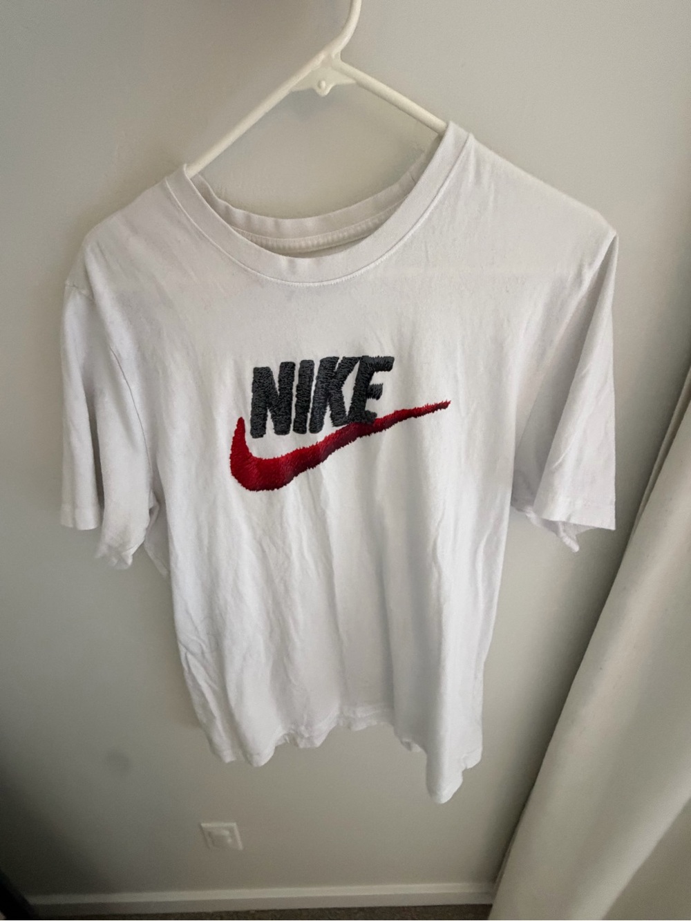 Nike White Short Sleeve Tee with Red Swoosh and Black Logo